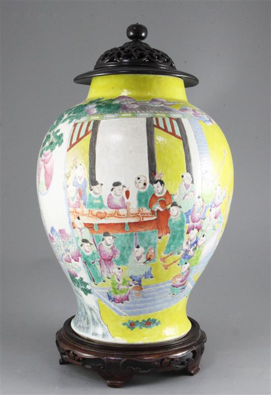 A Chinese yellow ground Hundred Boys jar, 19th century, 49cm including wood stand and cover